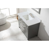 Vanity cabinets constructed from solid birch wood and MDF to prevent warping Porcelain integrated countertop and sink